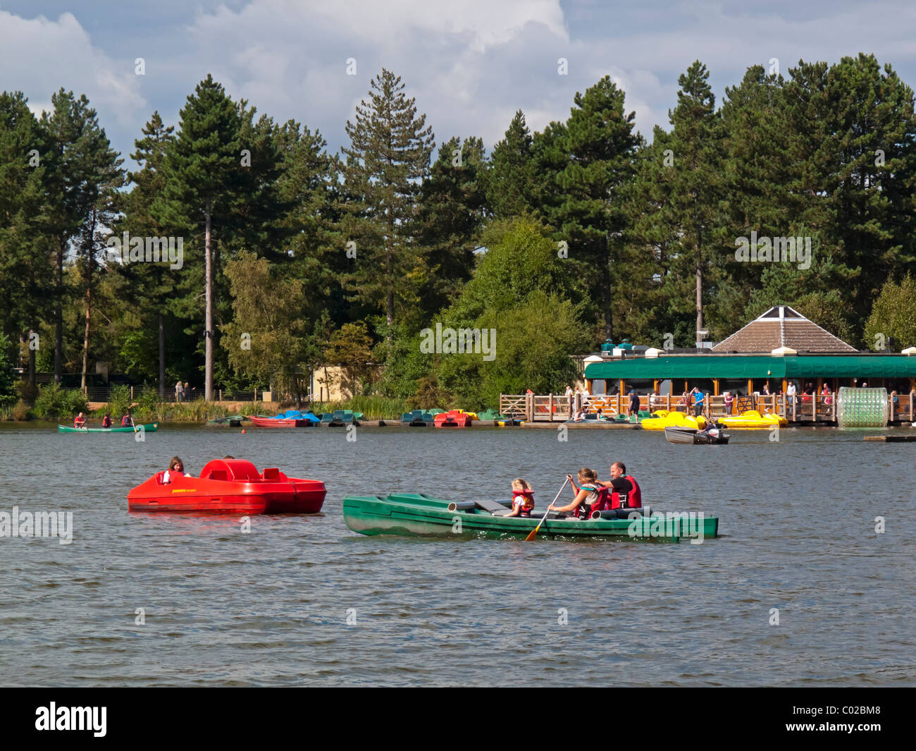Kayaks, pedaloes and canoes on the lake at Center Parcs Sherwood Forest near Rufford in Nottinghamshire England UK Stock Photo