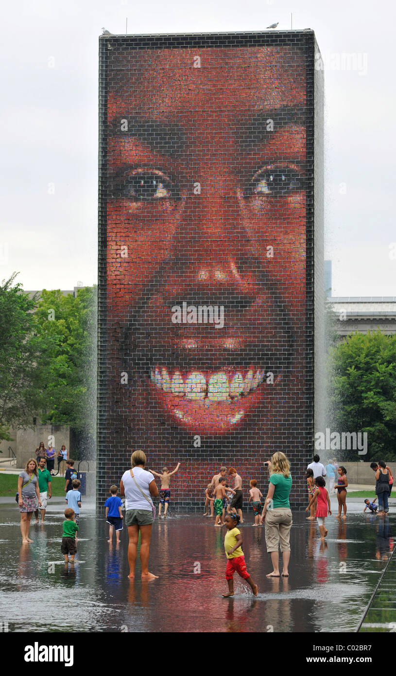 Children having fun with the water fountains of Crown Fountain, Millennium Park, Chicago, Illinois, United States of America Stock Photo