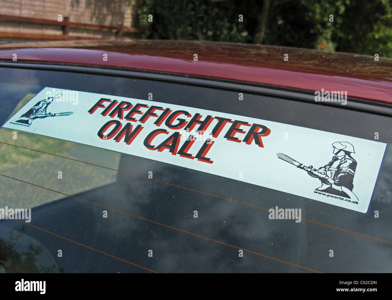 Firefighter On Call sign on a car widow Stock Photo