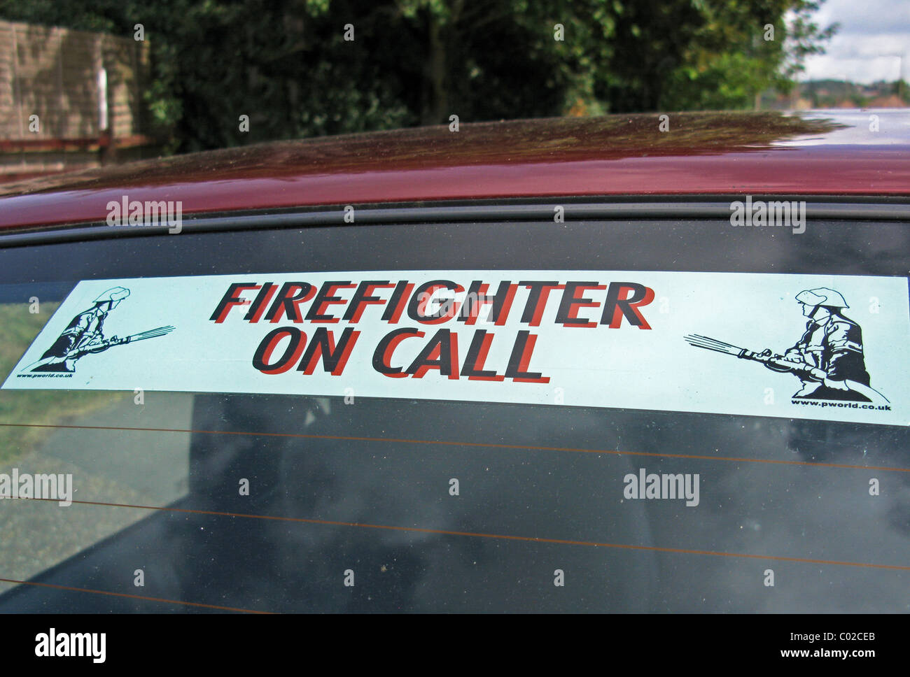 Firefighter On Call sign on a car widow Stock Photo