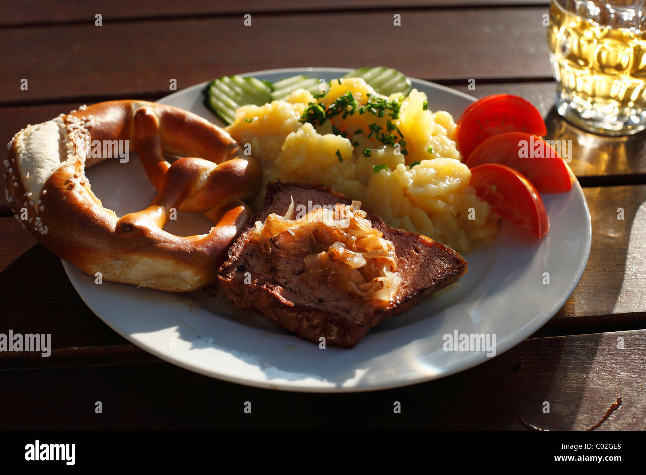 Leberkaese spam with roasted onions, pretzels and potato salad, Schwaben, Bavaria, Germany, Europe Stock Photo
