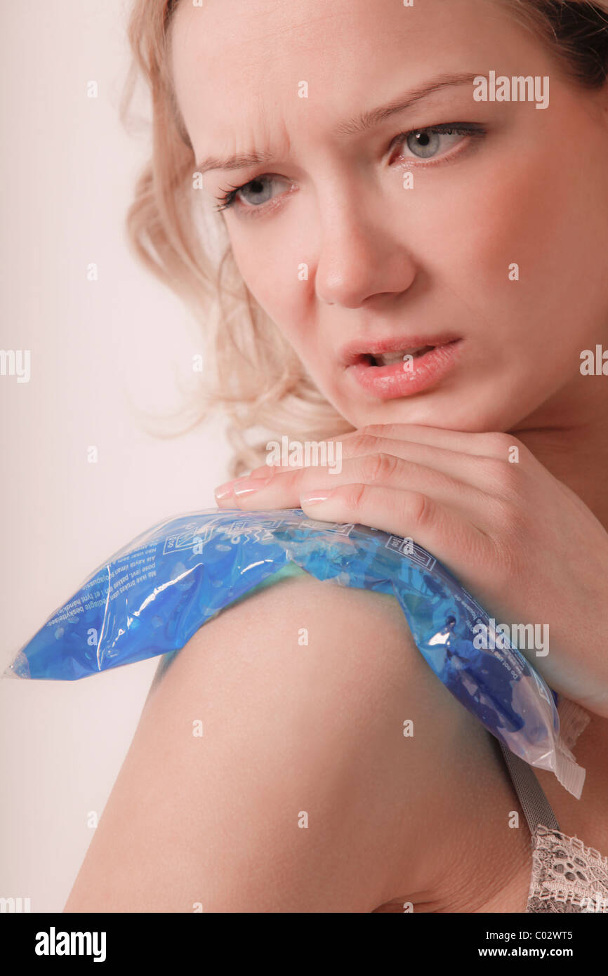girl with ice bag on shoulder Stock Photo
