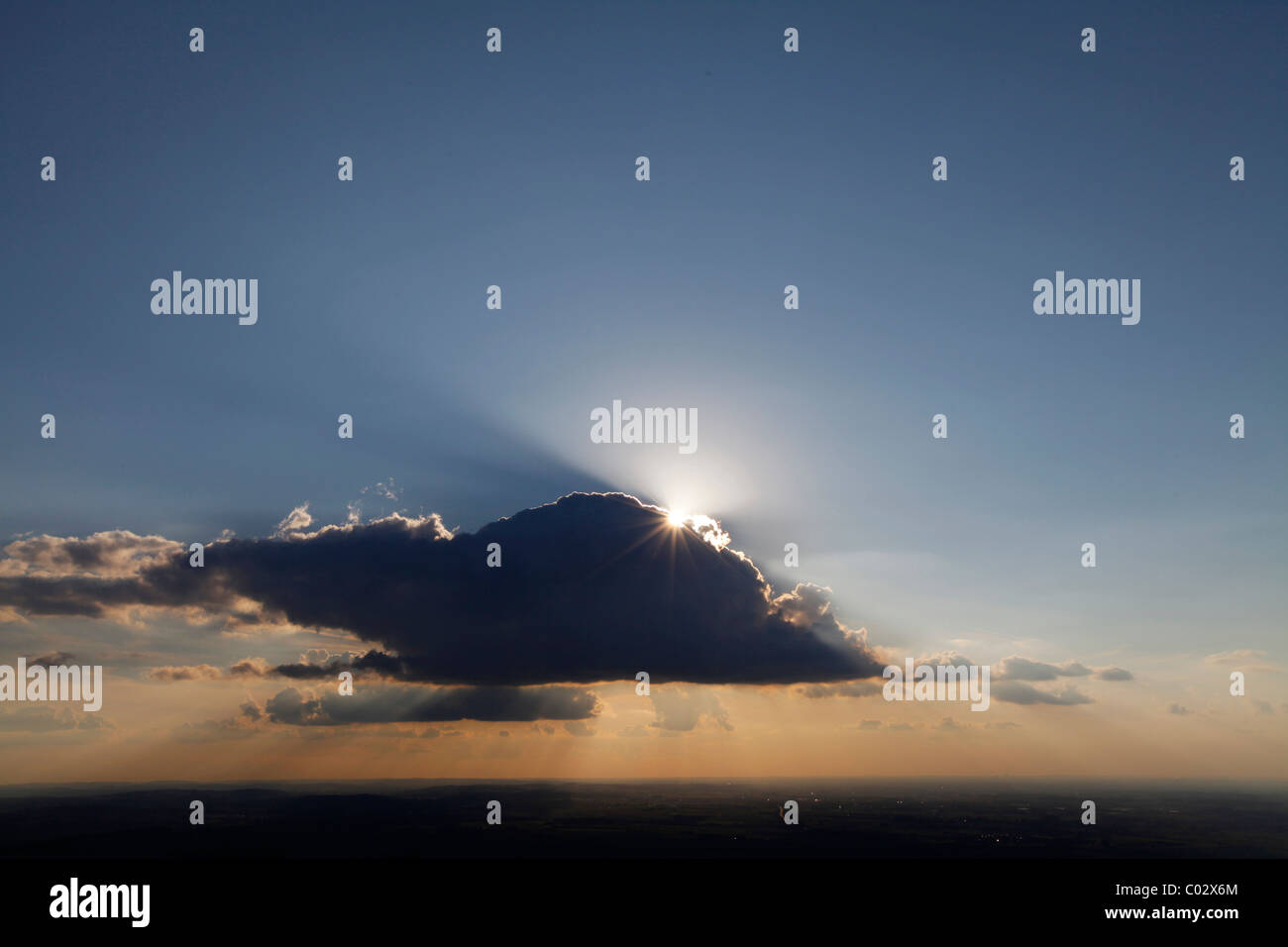 Aerial photo, Soest Boerde, sun with sun rays behind a cloud in the evening sky, Soest, Soest district, North Rhine-Westphalia Stock Photo