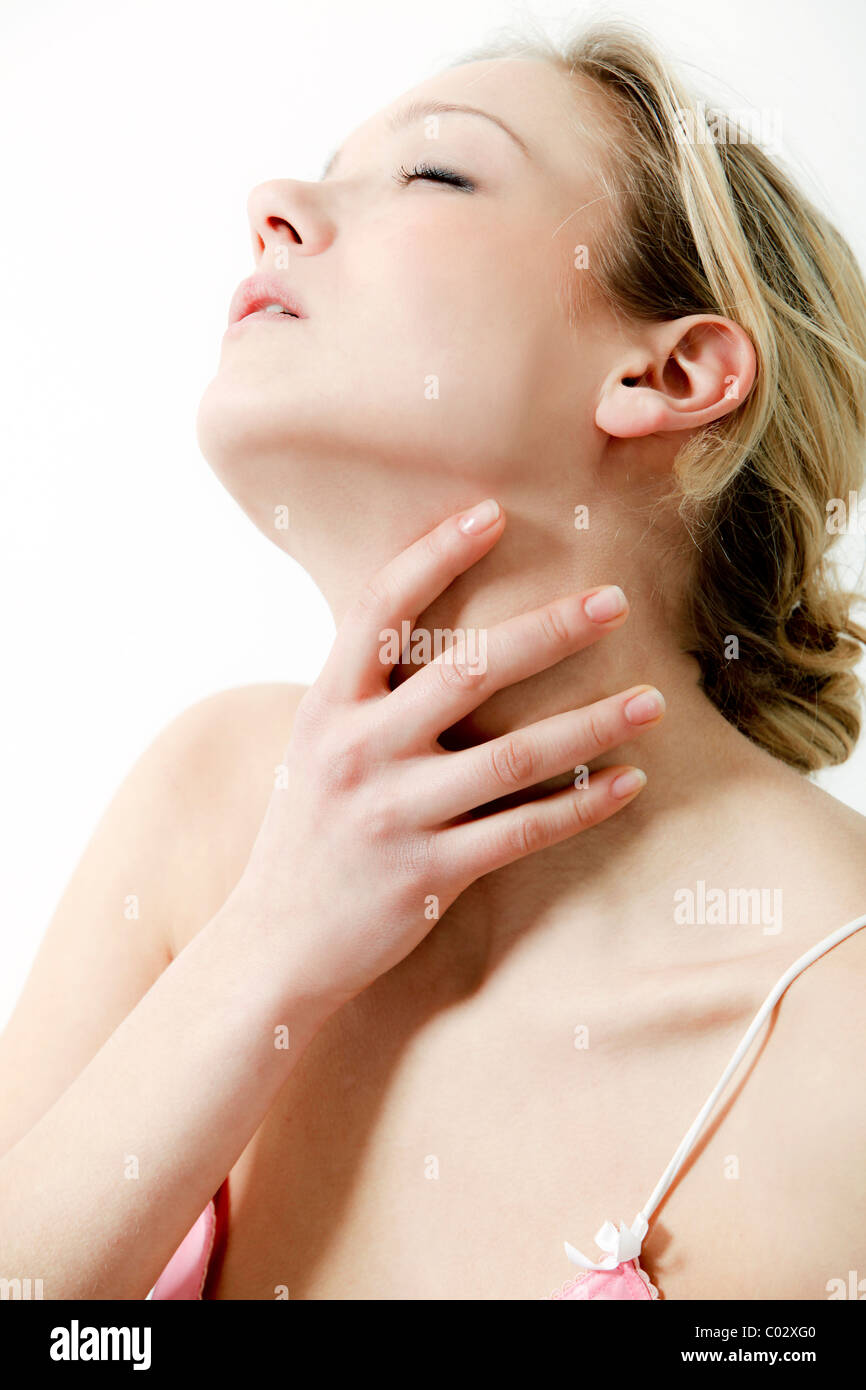 girl hand on neck, indoor Stock Photo