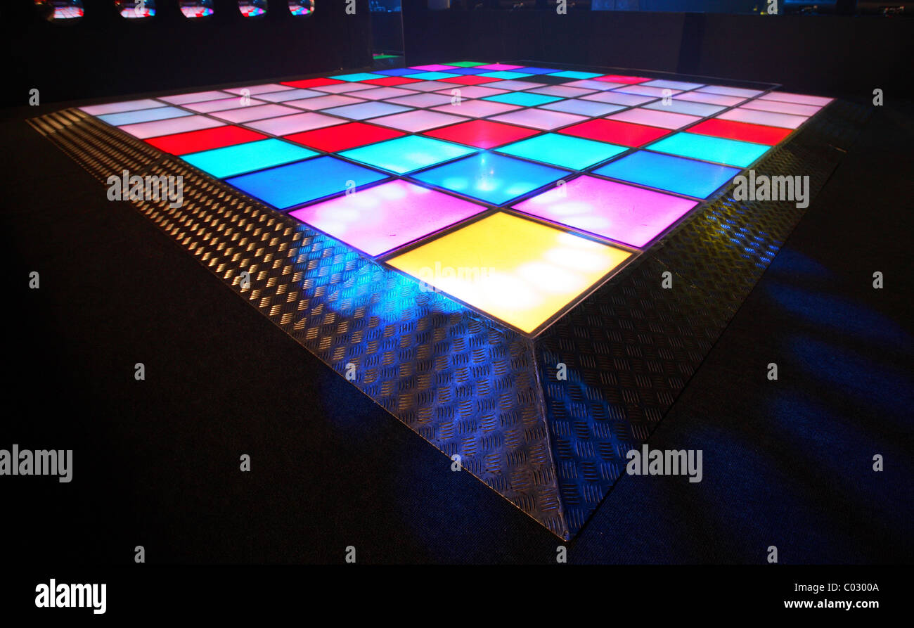 an empty illuminated disco dance floor Stock Photo