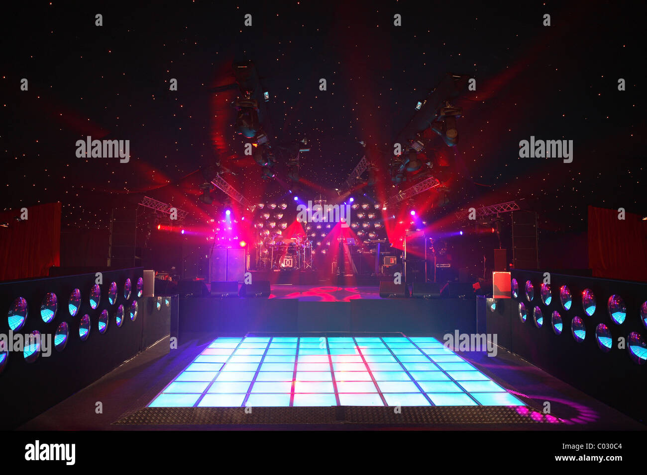 an empty illuminated disco dance floor Stock Photo