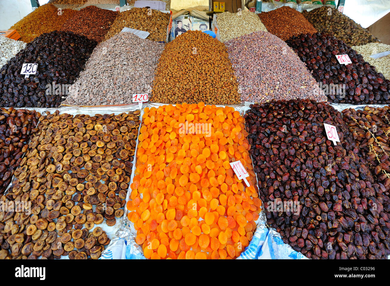 Dried apricots, dates, figs and nuts put out for sale at a stall at the