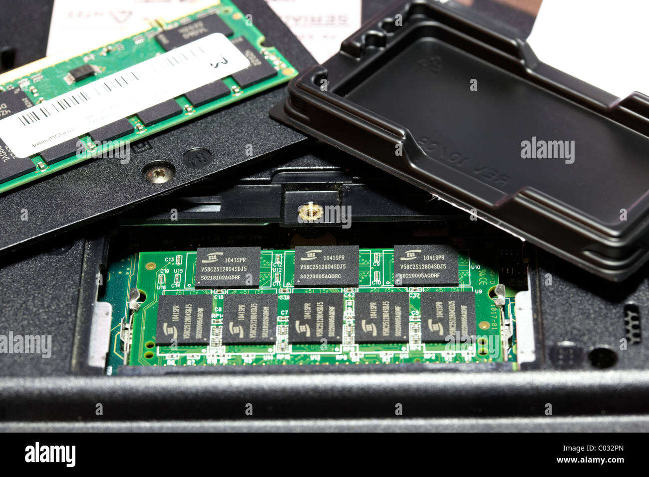 replacing upgrading DDR memory stick ram in a old laptop computer Stock Photo