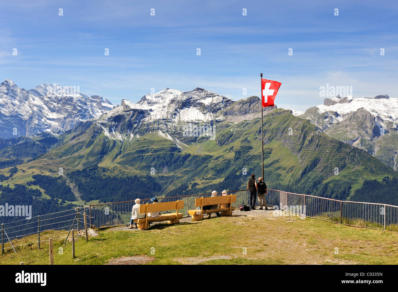 Viewing platform at the mountain top station of the 2334 metre high Maennlichen Mountain overlooking the 2973 metre high Stock Photo
