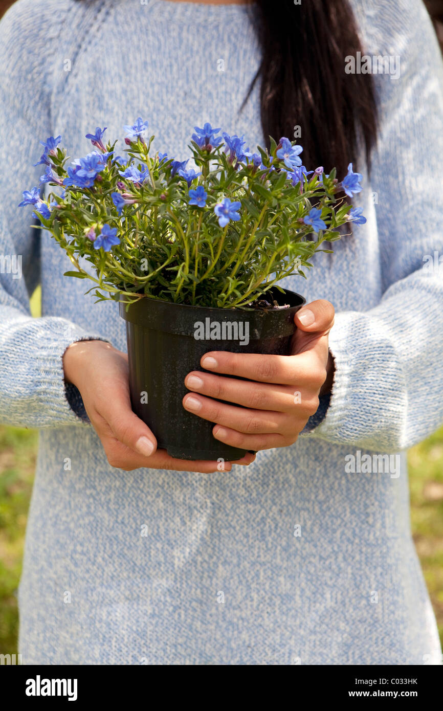 girl holding a flower pot Stock Photo - Alamy