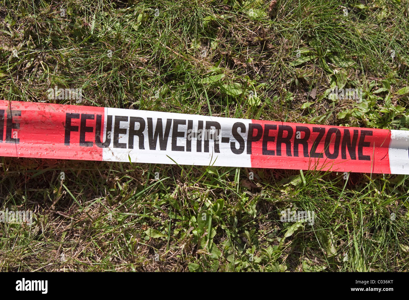 Red and white barrier tape, fire tape, labelled FeuerwehrSperrzone