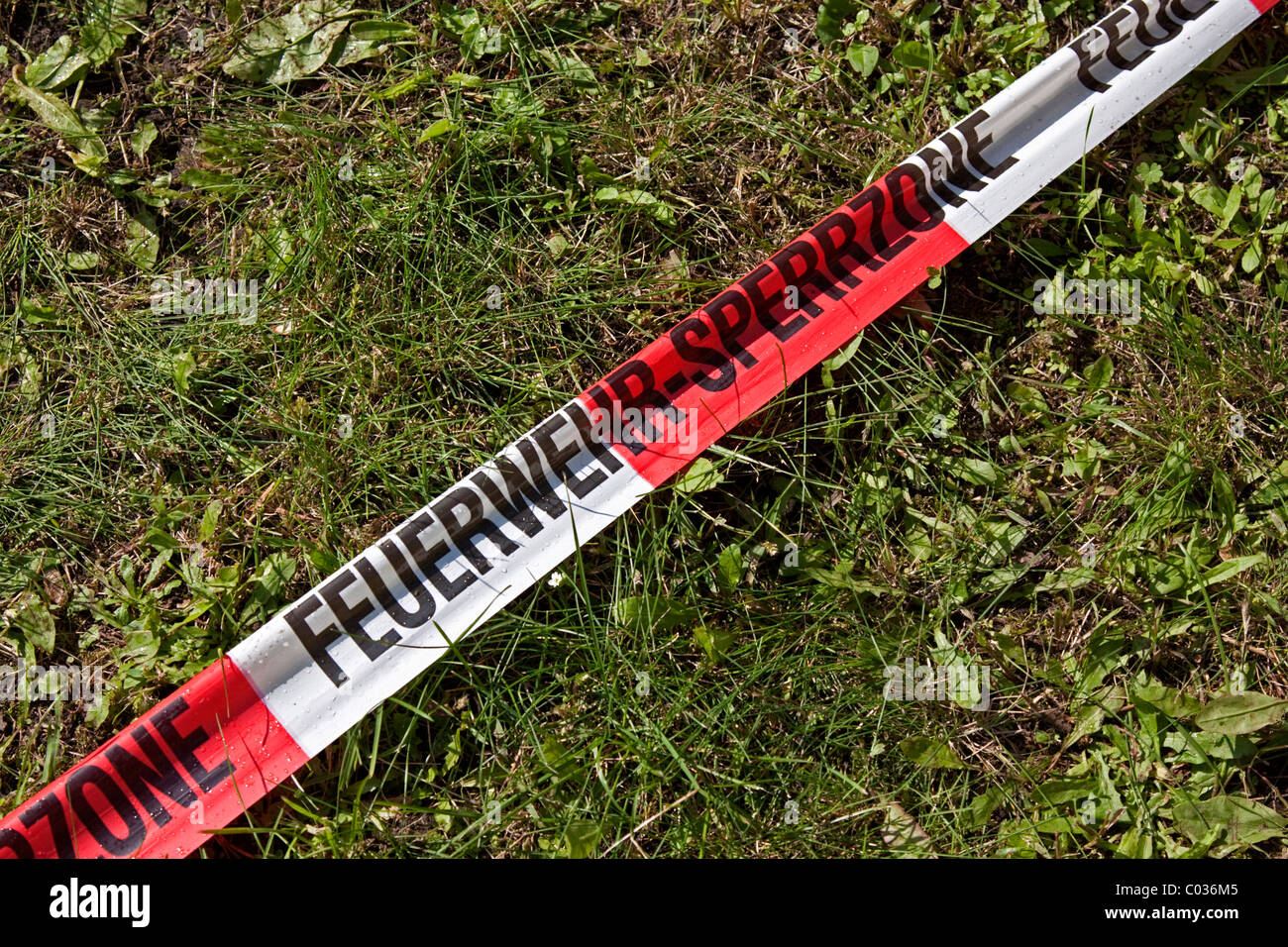Red and white barrier tape, fire tape, labelled FeuerwehrSperrzone
