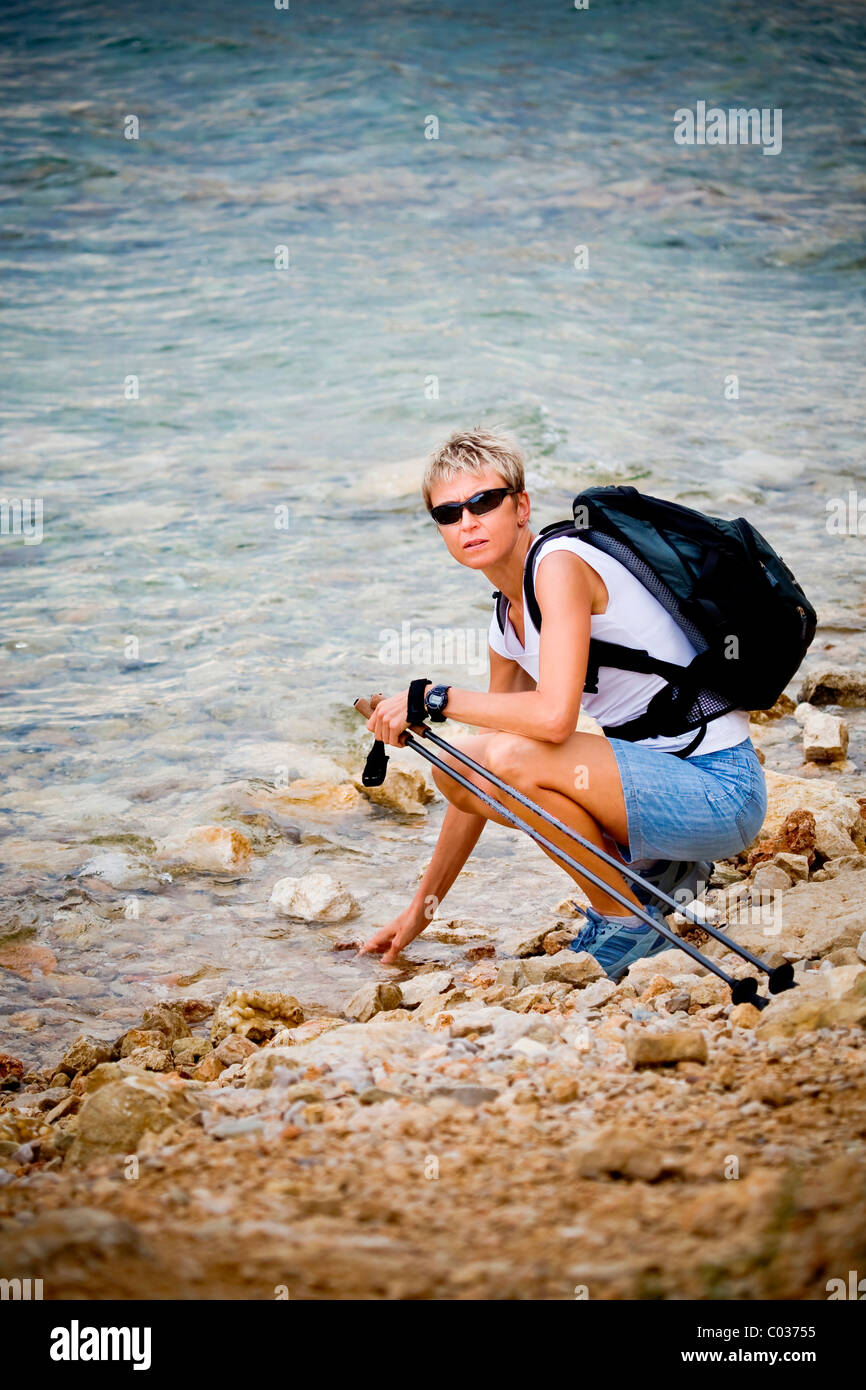 Woman hiking along lake hi-res stock photography and images - Alamy