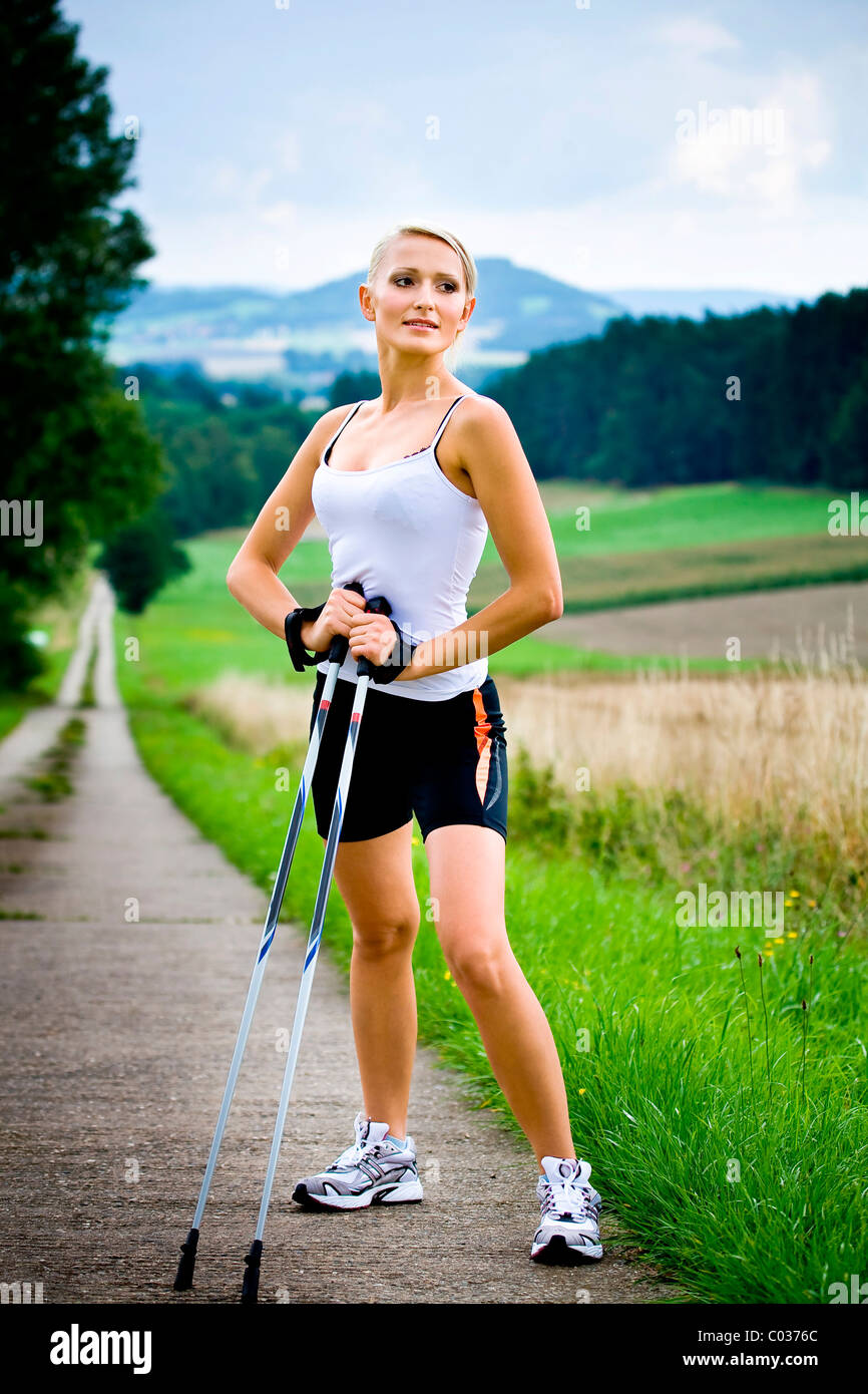 Young woman during nordic walking hi-res stock photography and images ...