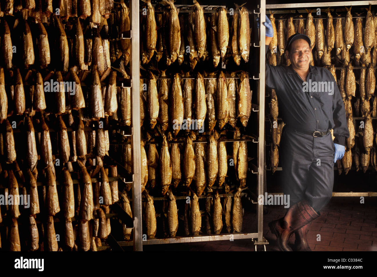 Smoked fish house worker Stock Photo Alamy