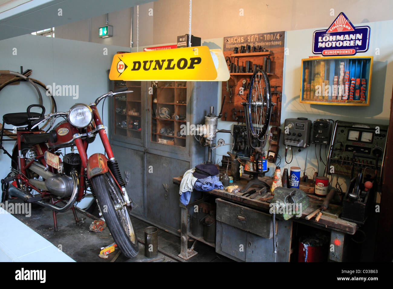Historic motorcycle workshop, Dunlop neon sign, ErfinderZeiten: Auto- und Uhrenmuseum, Time of Innovators: Museum of Cars and Stock Photo