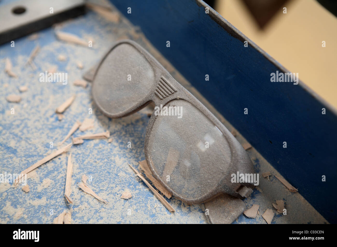 Safety goggles left in dust Stock Photo