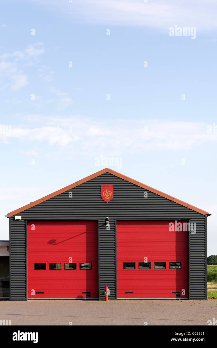 Small firestation with red doors, Zoutelande, Walcheren, Zeeland, Netherlands, Benelux, Europe Stock Photo