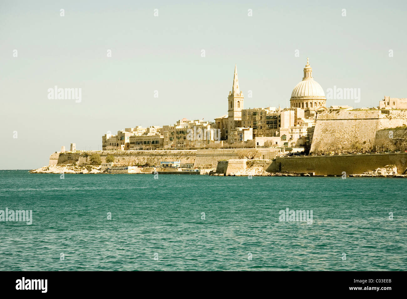 View of the old town of Valletta with St. Paul's Pro-Cathedral, the Carmelite Church and Marsamxett Harbour, Valletta, Malta Stock Photo