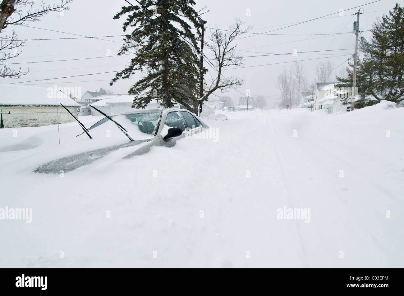 A car buried in deep snow during a snow storm in Davis, West Virginia