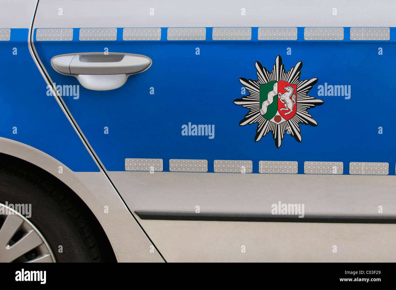 Coat of arms of North Rhine-Westphalia on a blue police car Stock Photo