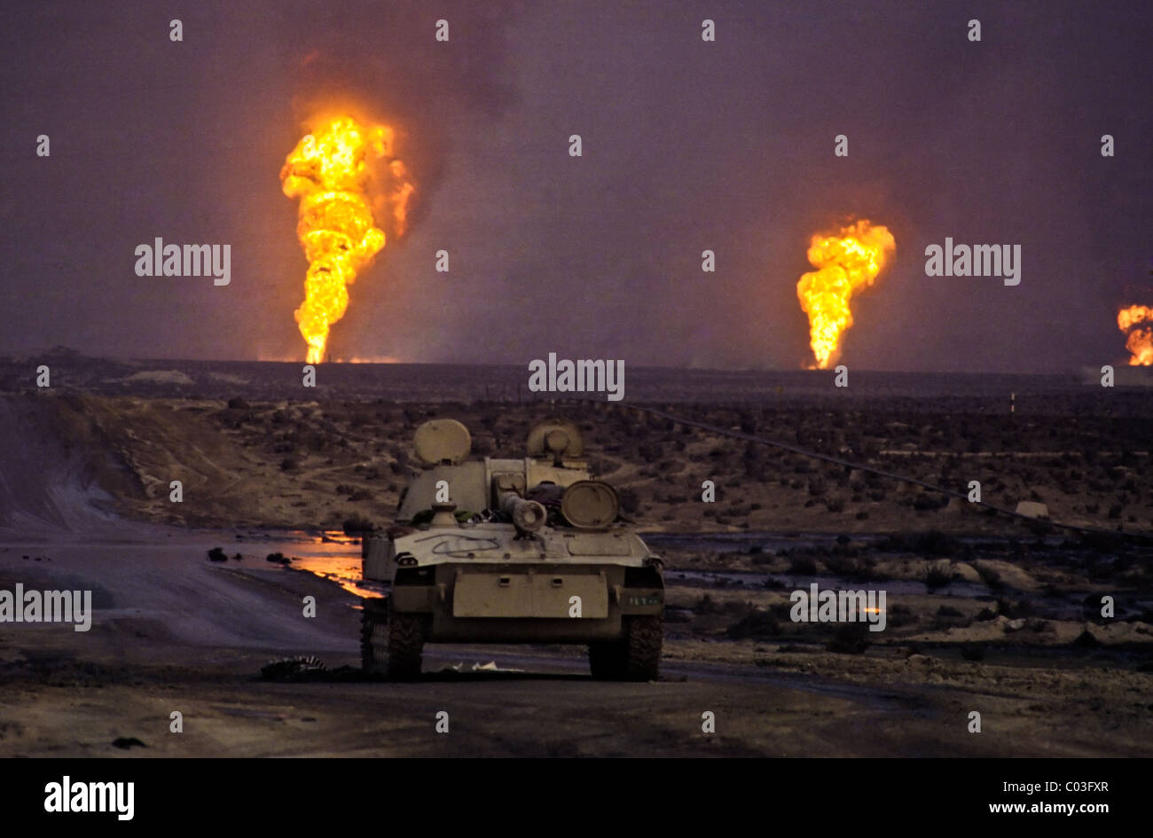 Destroyed vehicles on the Basrah highway following the defeat of Iraq in the Gulf War. Stock Photo