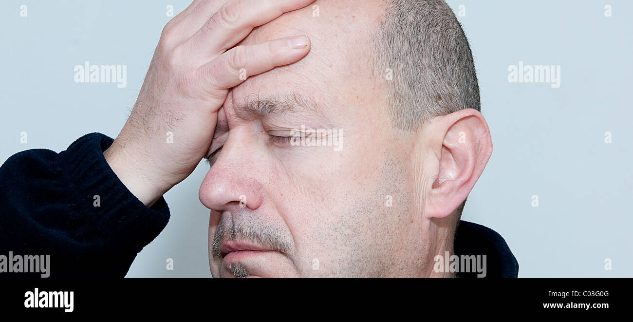 A man with head ache Stock Photo