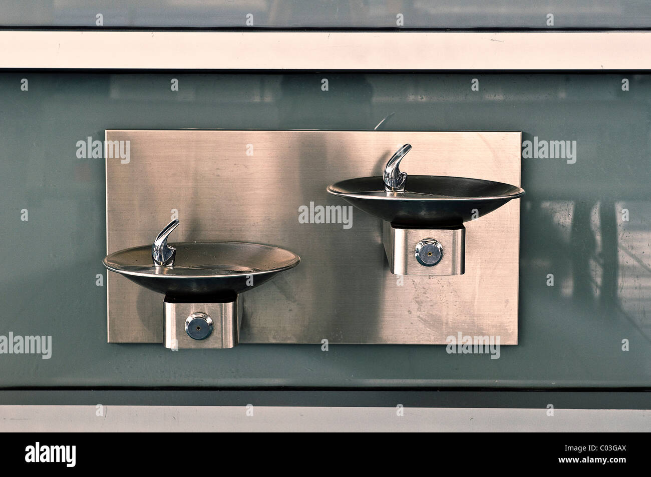 Two sinks at different heights, for children and disabled people, in the waiting room, Iceland Staten Ferry, New York, USA Stock Photo