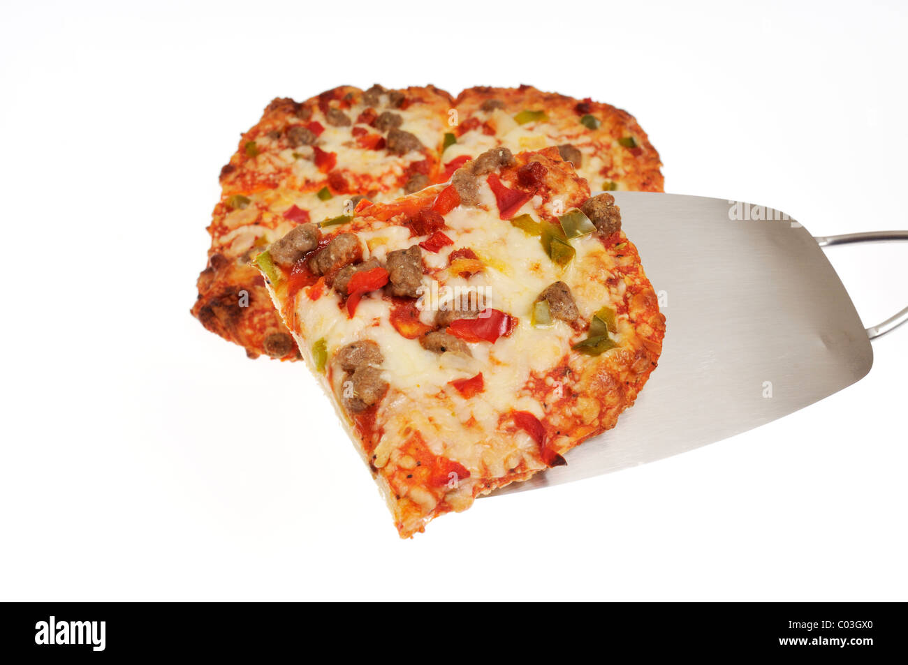 Pizza slice on spatula with rectangular pizza on white background, cutout. Stock Photo