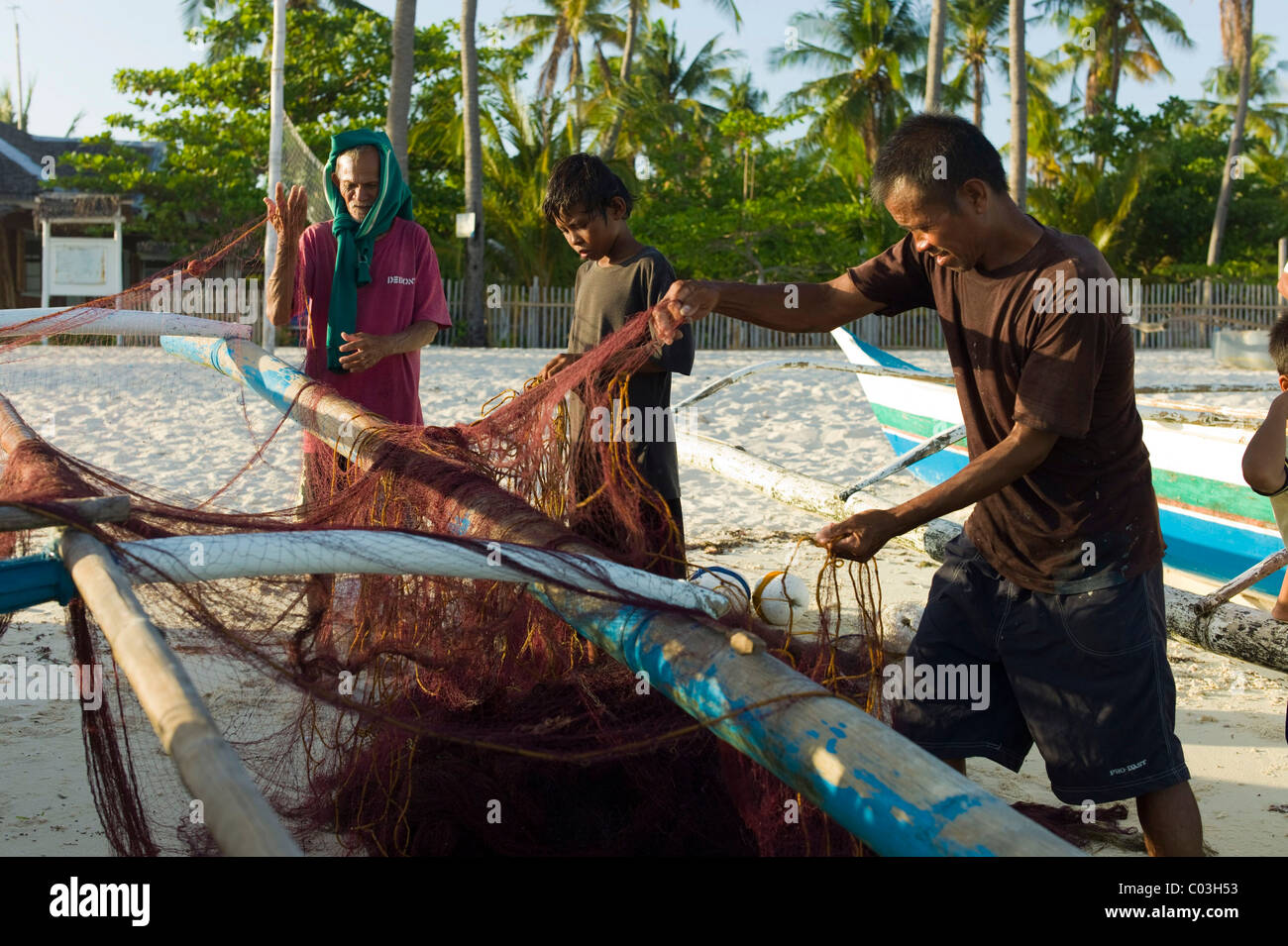 Fishermen on the beach, Malapasqua, Philippines, Asia Stock Photo