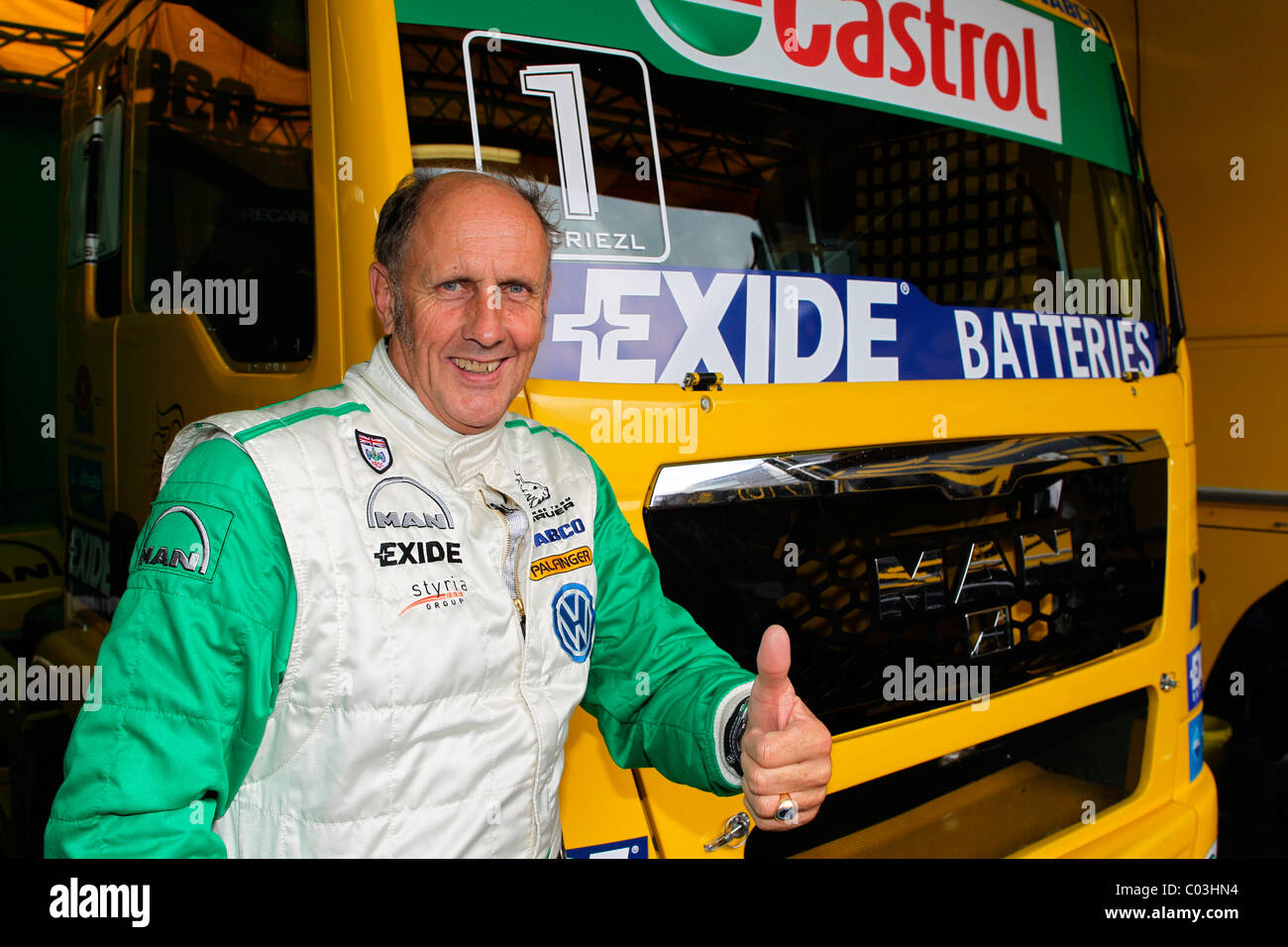 ADAC Truck Grand Prix Nuerburgring 2010, Hans-Joachim Stuck, a German racing driver, in front of a MAN truck Stock Photo