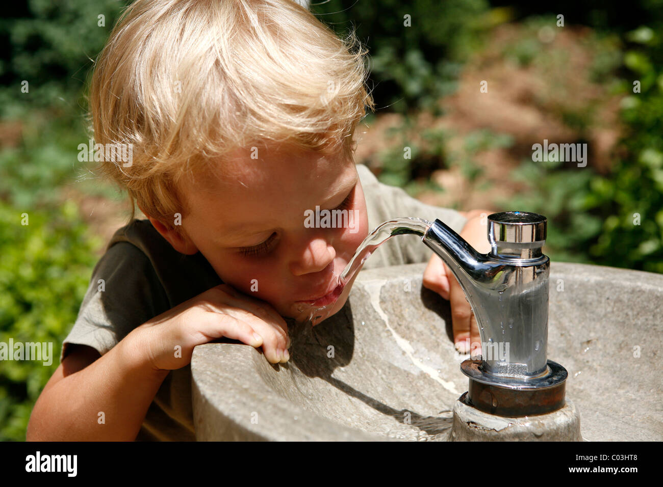 Boy, three years, drinking water from a public tap, Spain, Europe Stock  Photo - Alamy
