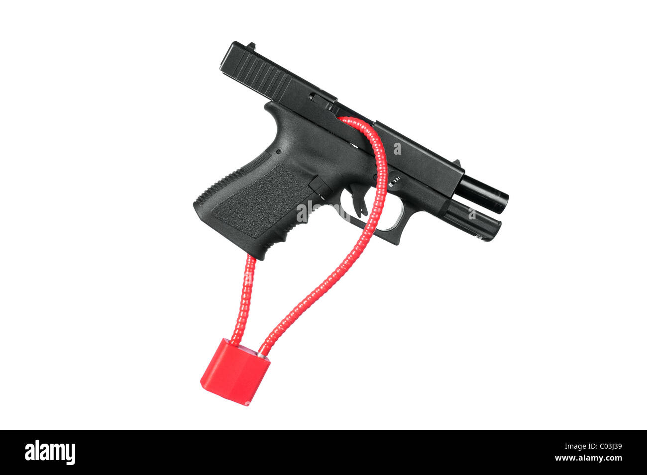 A hand gun firearm is locked with a safety cable to prevent anyone from firing the weapon. Stock Photo