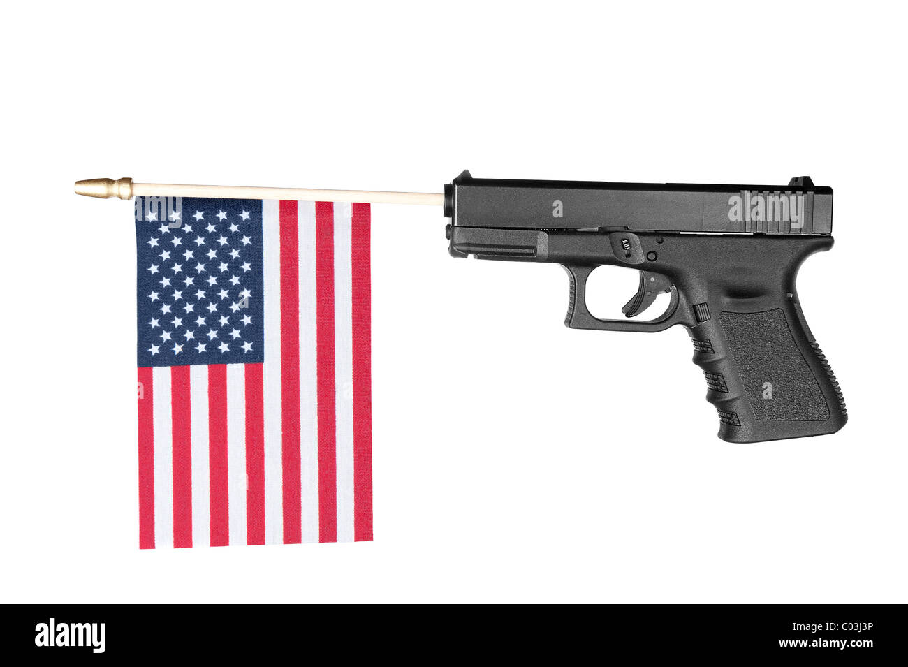 A pistol shoots out a flag. Isolated on white. Stock Photo