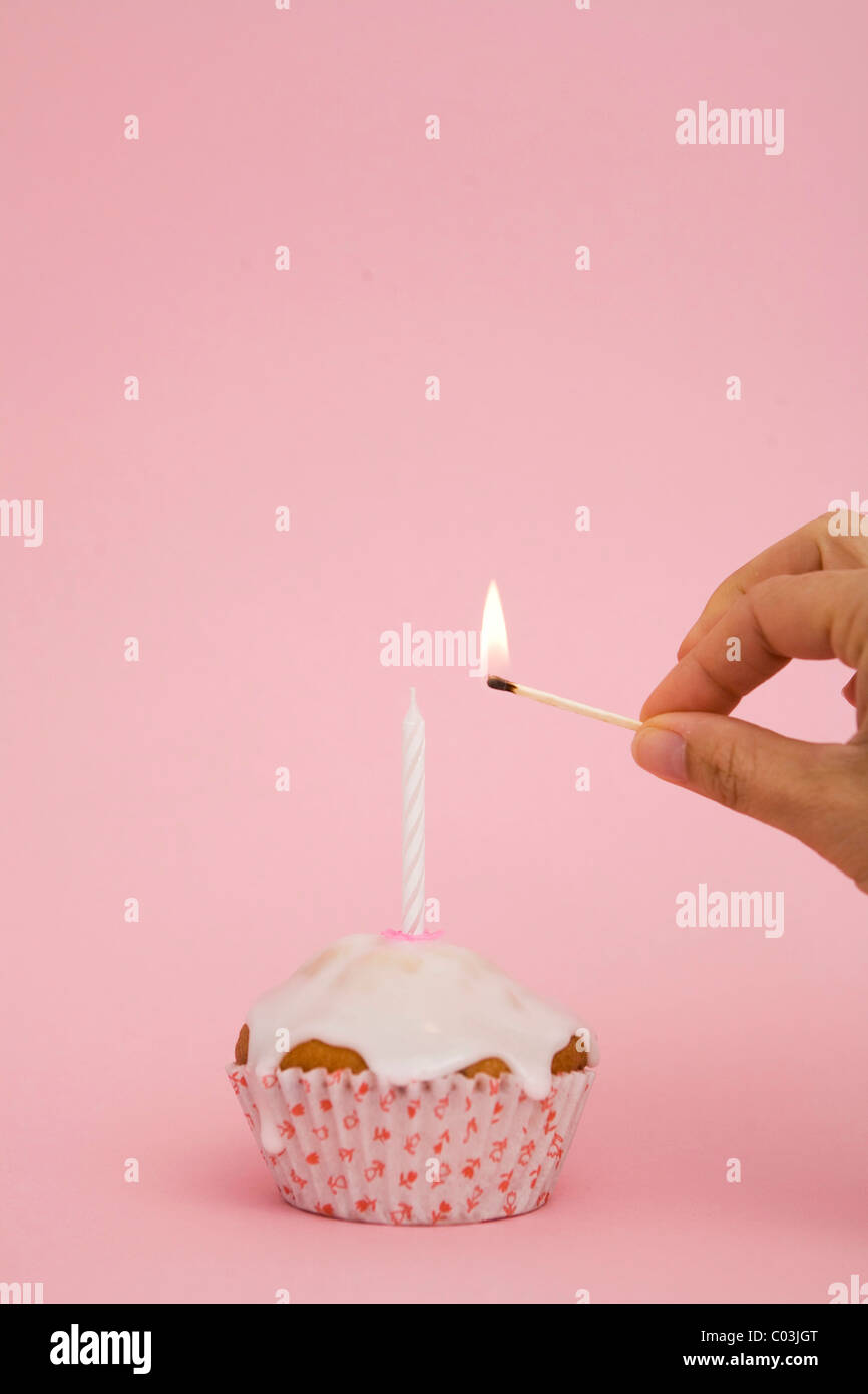 Muffin with candle, birthday Stock Photo Alamy