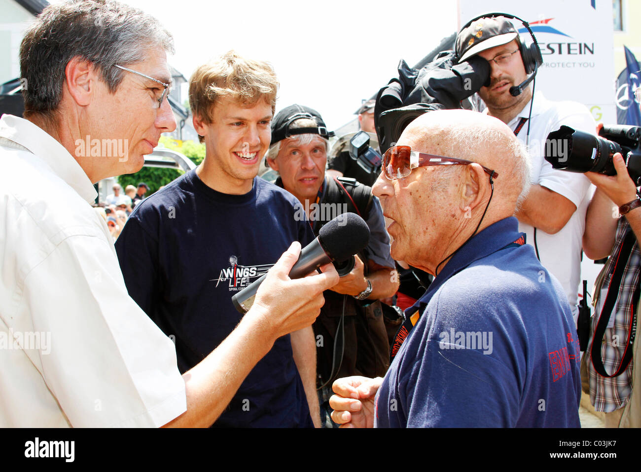 Sebastian Vettel during an interview with the racing legend Stirling Moss, Ennstal Classic 2010 Vintage Car Rally, Groebming Stock Photo