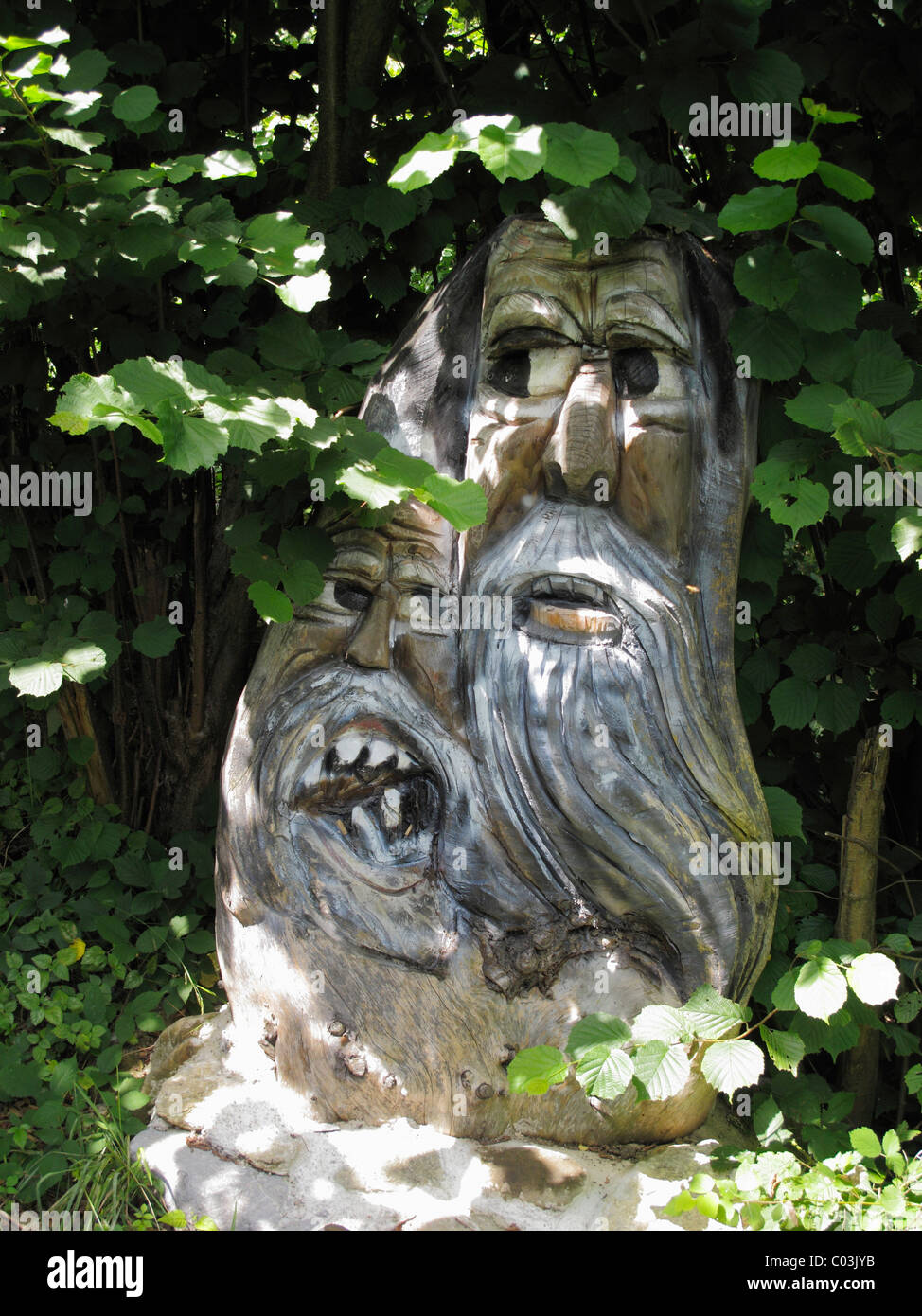 Carved wooden figures, forest spirits, spa garden, Bad Heilbrunn, Toelzer Land, Upper Bavaria, Bavaria, Germany, Europe Stock Photo