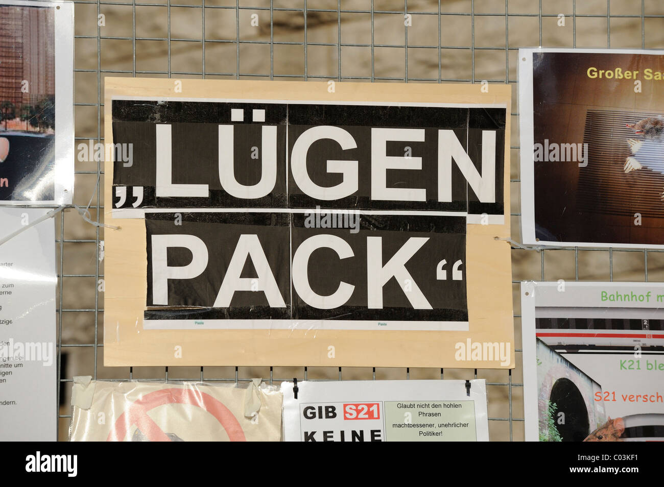 Sign with the message Luegen Pack, German for pack of lies, on the fence of the Stuttgart railway station because of the Stock Photo
