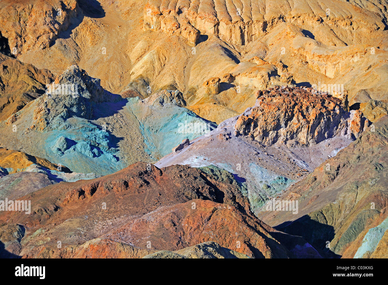 Rocks discoloured by minerals at the Artist's Palette in the evening light, Death Valley National Park, California, USA Stock Photo