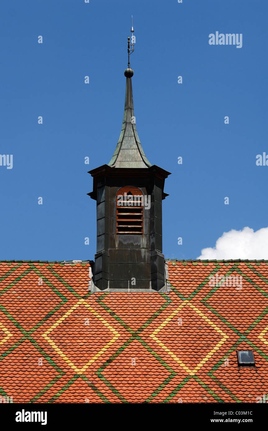 Colourful roof and spire of the church, Eglise des Soeurs, Grand'Rue, Ribeauvillé, Alsace, France, Europe Stock Photo