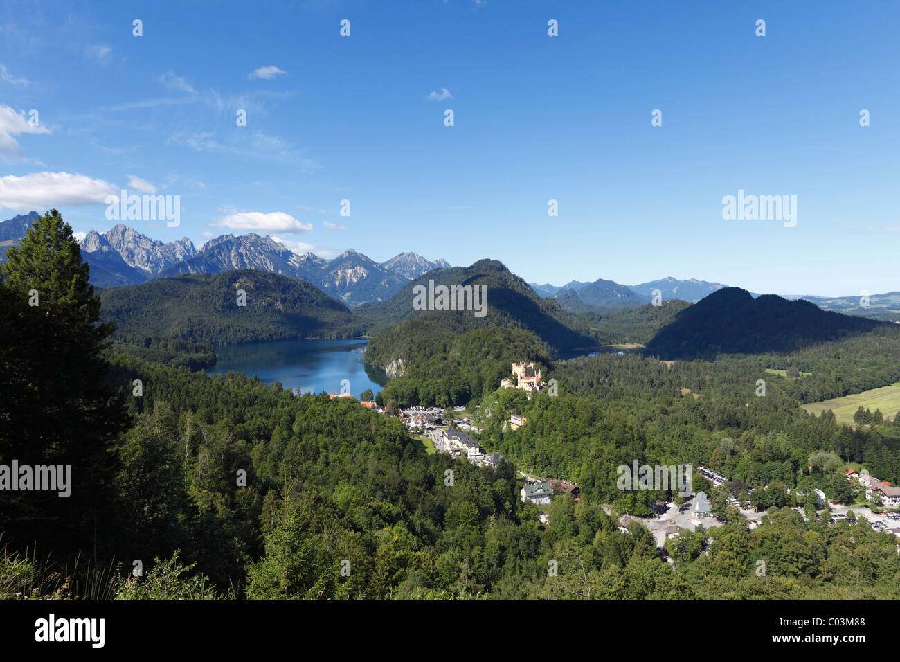 View from Jugend lookout point over Lake Alpsee and Schloss Hohenschwangau Castle towards the Tannheimer Mountains, Ostallgaeu Stock Photo