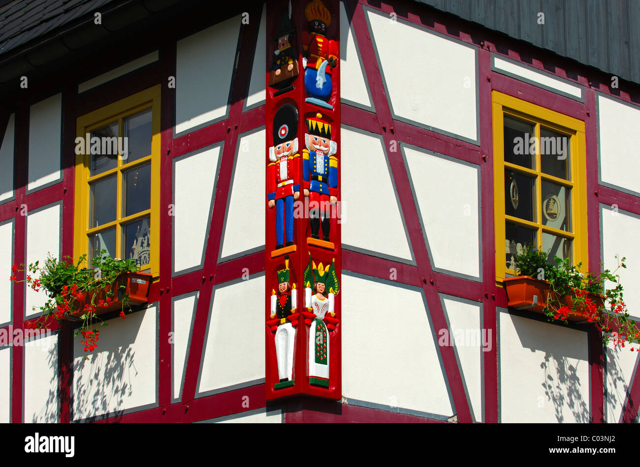 Wood carvings of typical Christmas motifs at the timber of a traditional half-timbered house, Seiffen, Saxony, Germany Stock Photo