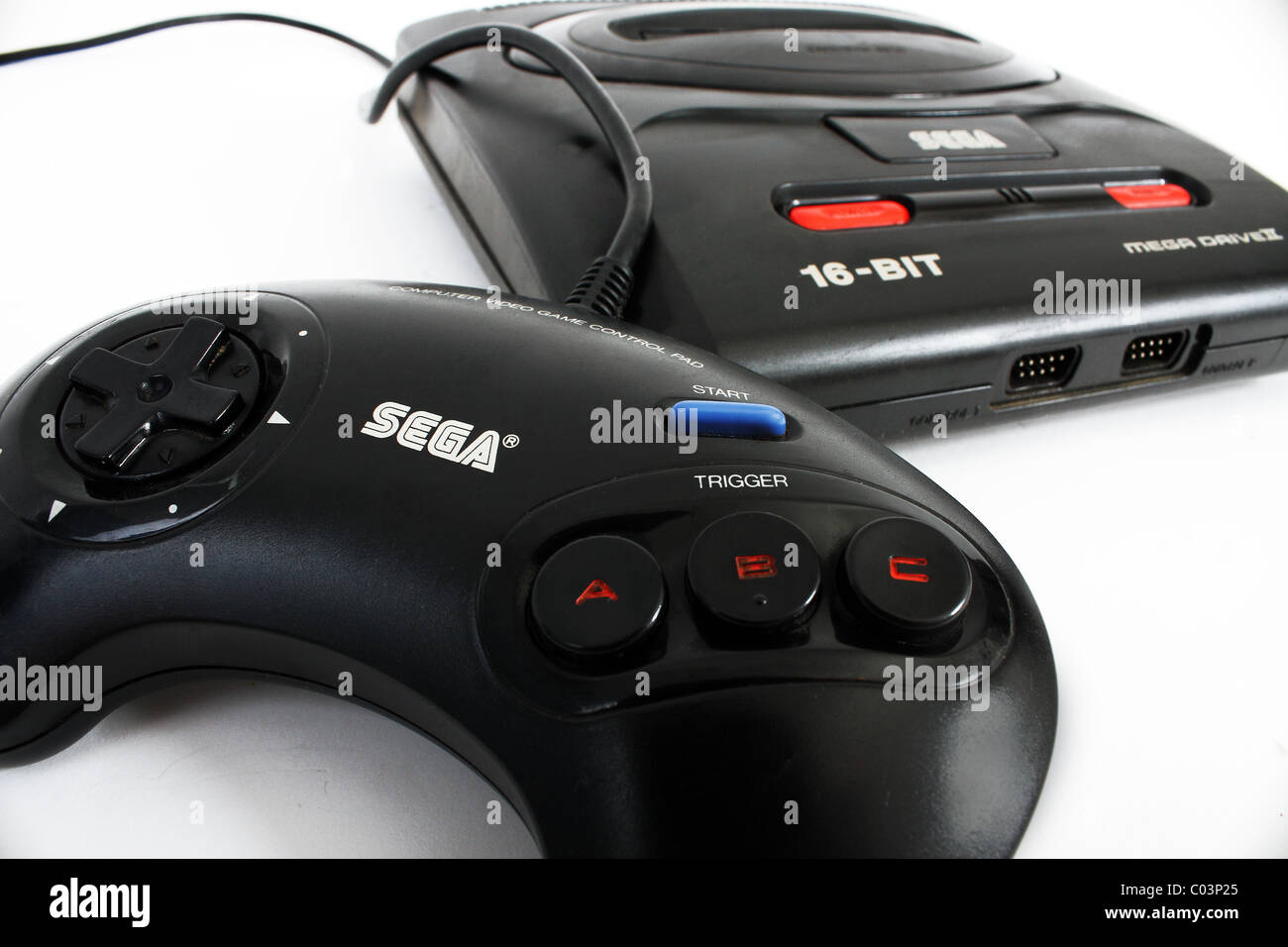 An old retro gaming video games console system called the Sega Mega Drive 16 Bit with handheld controller Stock Photo