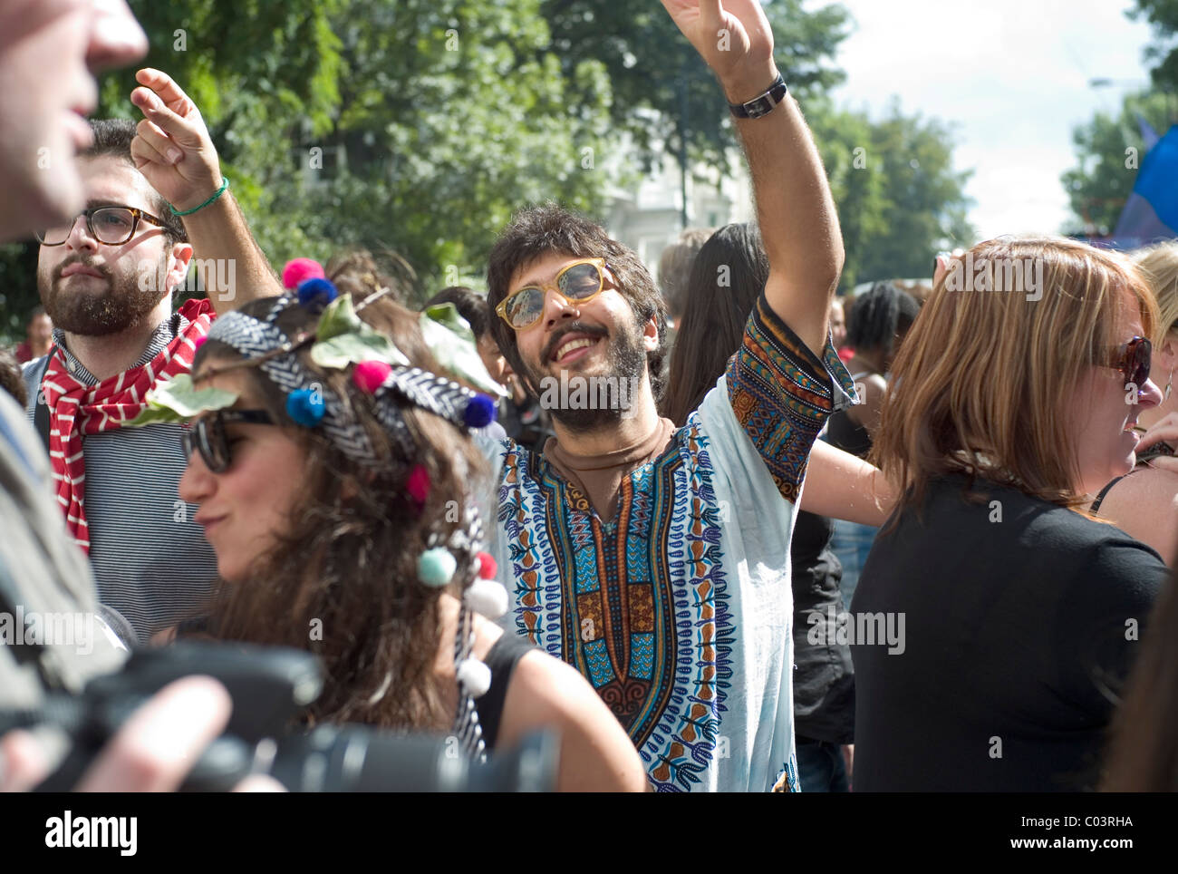 Man dancing in the street at the Notting Hill Carnival, London 2010, wearing 70's flowery shirt Stock Photo