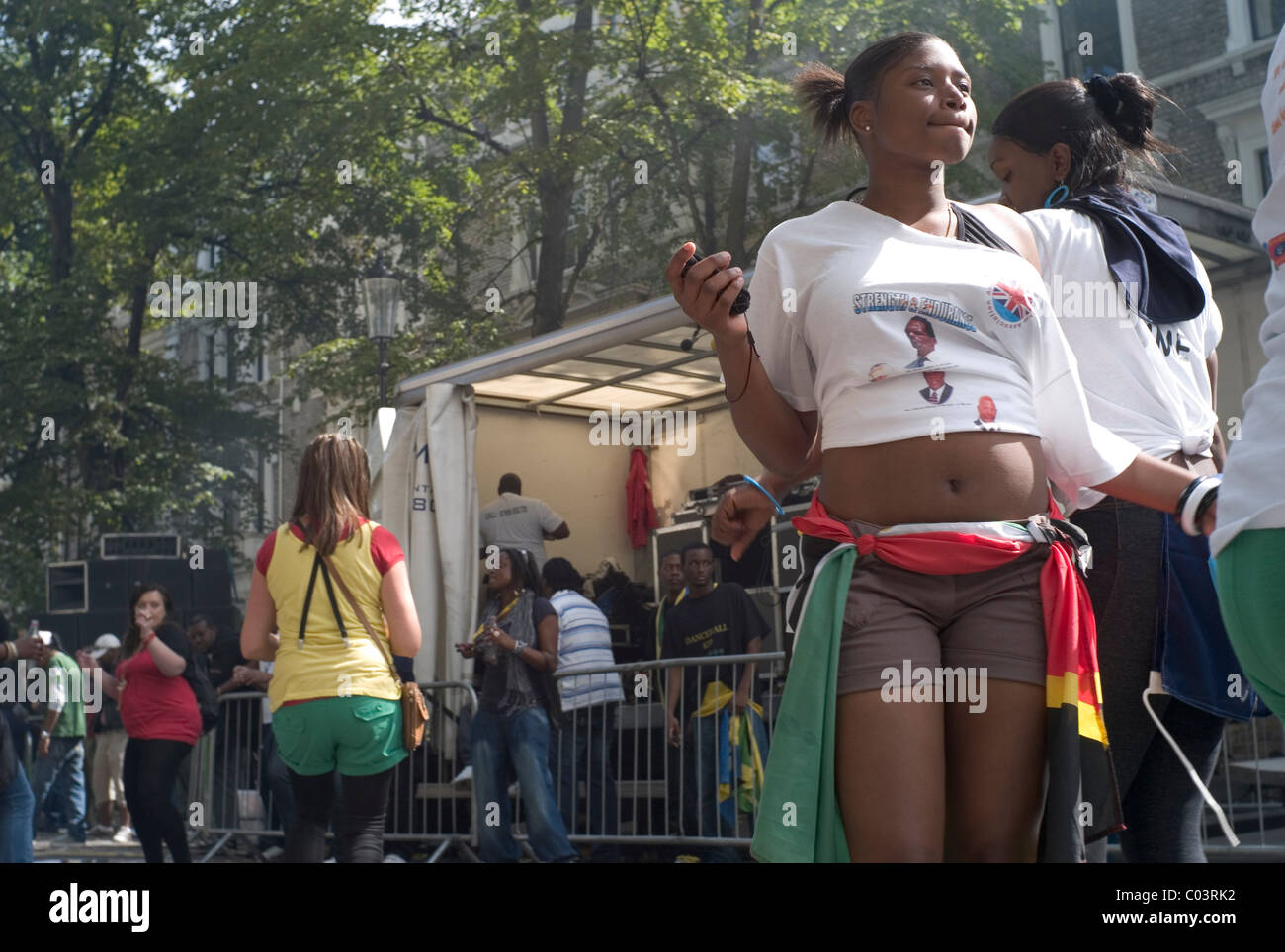 Young black girls dancing next to a sound stage at the Notting Hill Carnival, 2010, London Stock Photo