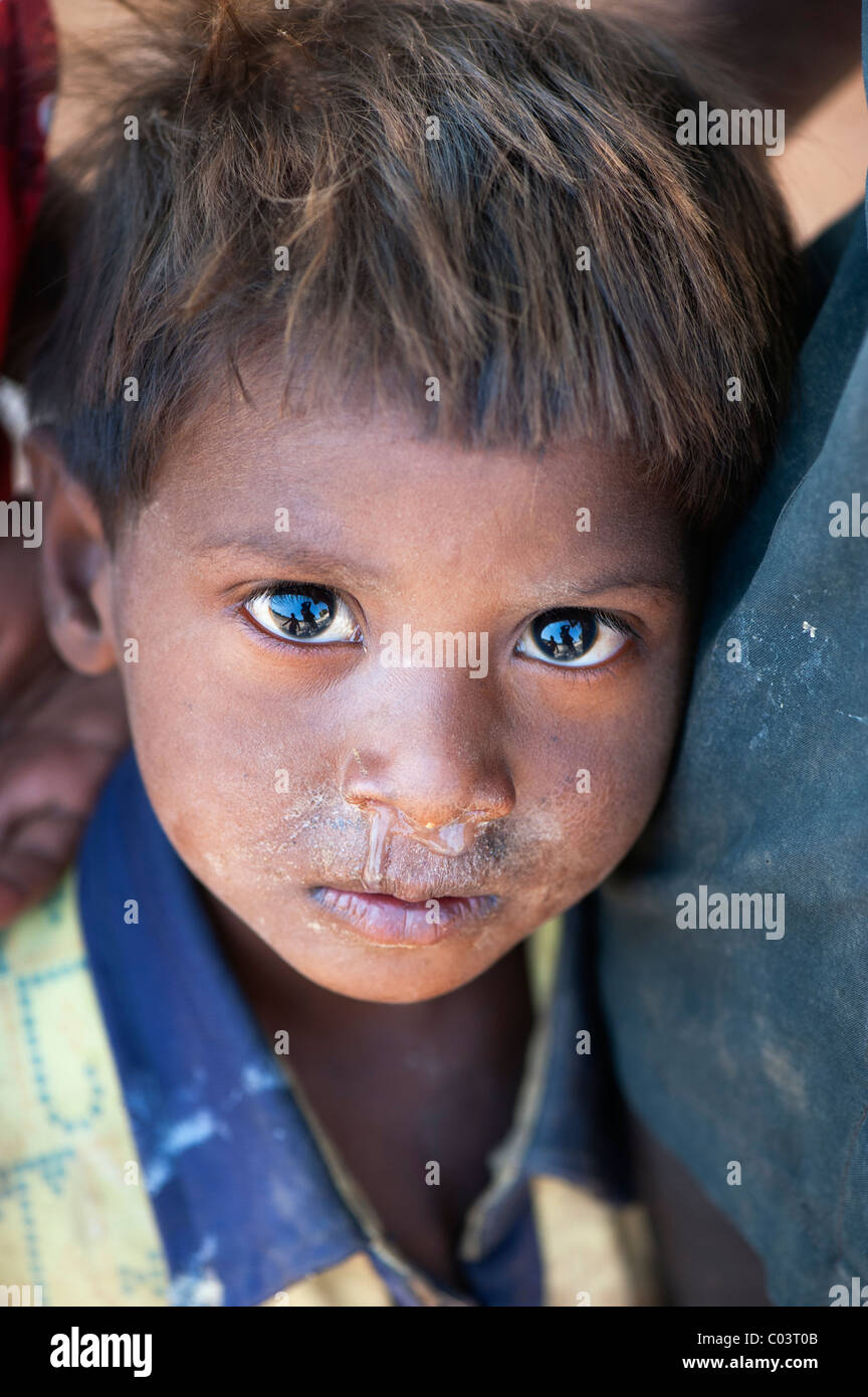 Young poor lower caste Indian street boy staring. Andhra Pradesh, India. Selective focus Stock Photo