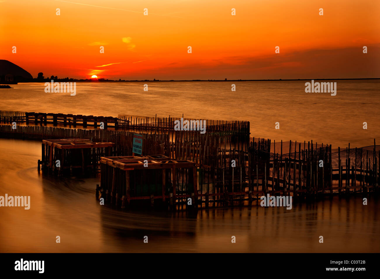 A "divari" (traditional fish farm) at the end of the bridge that connects Lefkada island with the mainland of Greece. Stock Photo