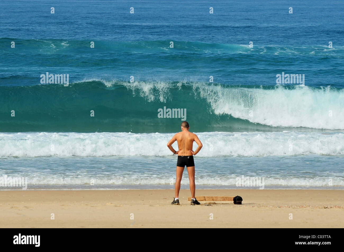 Athlete man exercise on the beach. Stock Photo