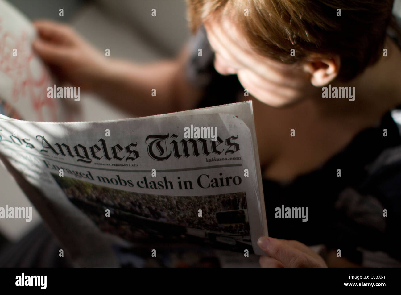 Female reading Los Angeles Times newspaper Stock Photo Alamy
