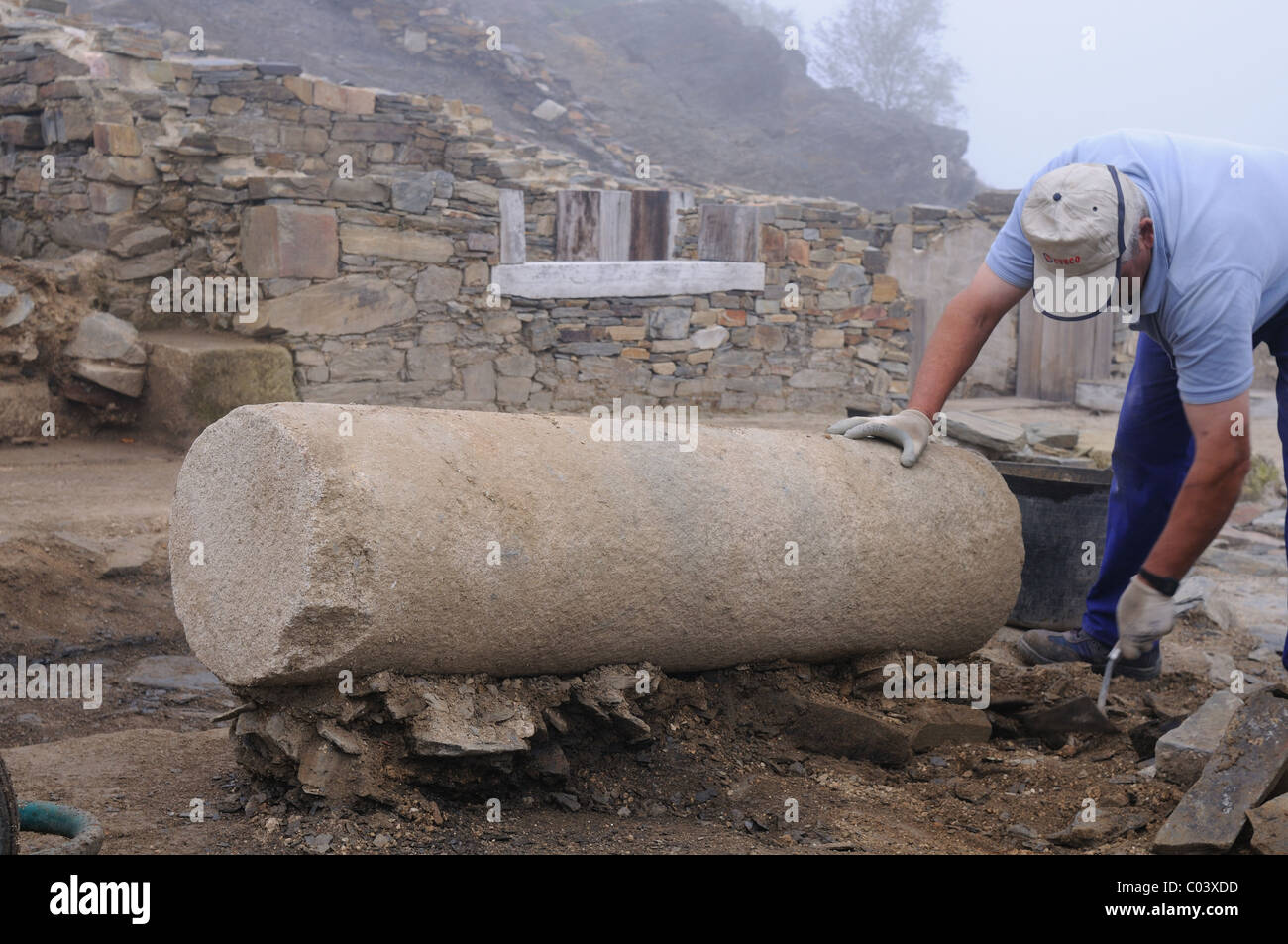 Working in the patio of the " Domus " Archaeological site " Chao Samartin " Asturias SPAIN Stock Photo